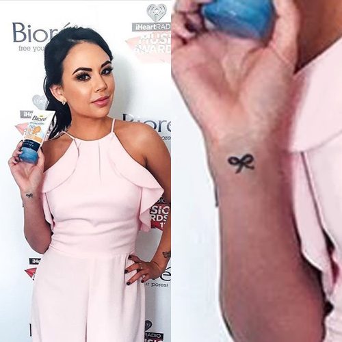 Bow on janel parrish right wrist 